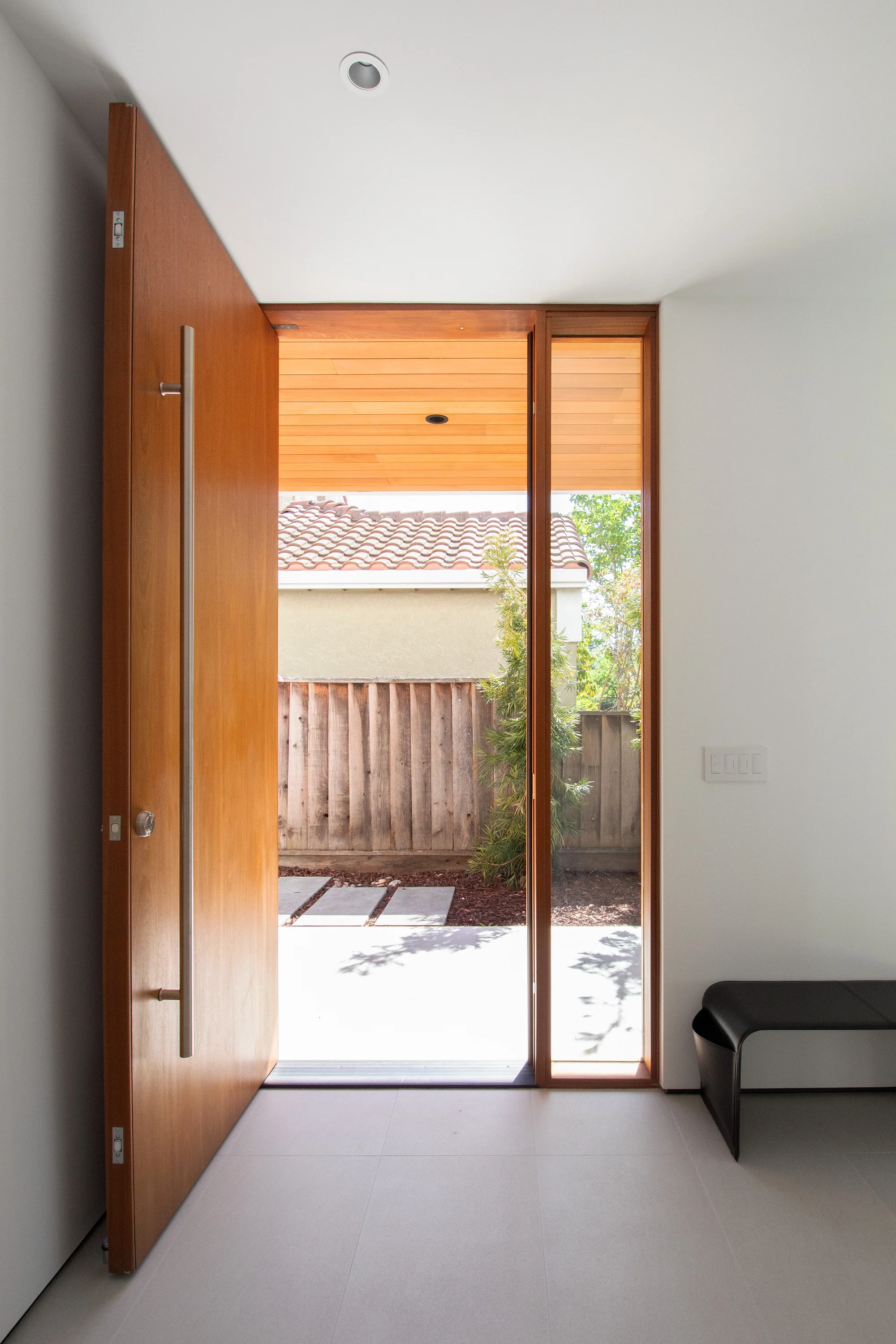 Entry hall with floor-to-ceiling glazing and built-in storage